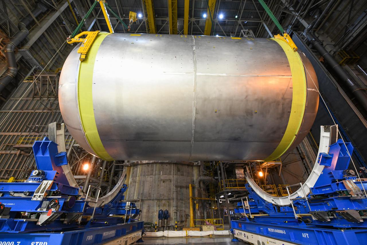 This image shows the latest progress NASA has made in manufacturing the liquid oxygen tank for the second core stage of NASA’s Space Launch System (SLS) rocket. The liquid oxygen tank will be used for the first crewed mission, Artemis II, of the agency’s Artemis program. Teams at NASA’s Michoud Assembly Facility in New Orleans recently completed internal cleaning of the liquid oxygen, or LOX, tank at the facility. Following the cleaning, crews prepared the propellant tank for the next phase of phase of assembly in a different area of the factory by moving, or breaking over, the tank from a vertical to horizontal position. The LOX tank is one of five major elements that make up the rocket’s massive 212-foot-tall core stage. The propellant tank holds 196,000 gallons of supercooled liquid oxygen to help fuel four RS-25 engines, and the internal cleaning ensures no contaminants make their way into the complex propulsion and engine systems of the deep space rocket. The stage, which includes a cluster of four RS-25, will produce more than 2 million pounds of thrust to help launch the SLS rocket and astronauts aboard NASA’s Orion spacecraft around the Moon for Artemis II.   NASA is working to land the first woman and the next man on the Moon by 2024. The agency’s SLS rocket offers more payload mass, volume capability and energy to speed missions through deep space and enable NASA’s Artemis lunar program. SLS, along with Orion, the human landing system, and the Gateway in orbit around the Moon are NASA’s backbone for deep space exploration. No other rocket is capable of carrying astronauts in Orion around the Moon in a single mission.
